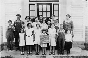 Class standing outside their rural school